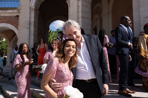 my dad and I dressed formally, half-hugging and looking into the camera